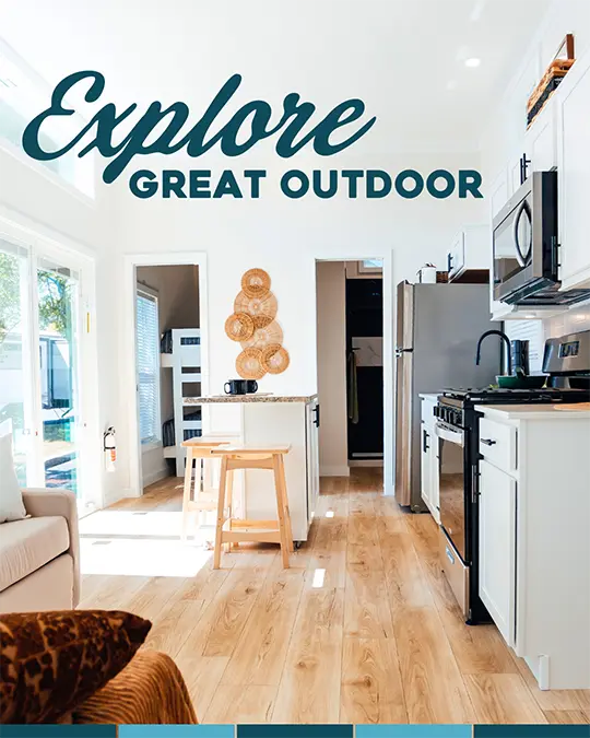 Explore Great Outdoor Cottages: kitchen and living area of a park model