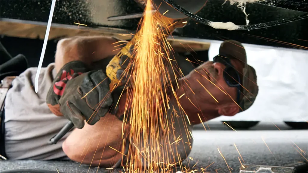 CallGOC technician welding under a park model