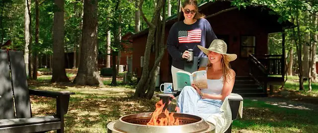 Two women by a campfire at North Fork Resort