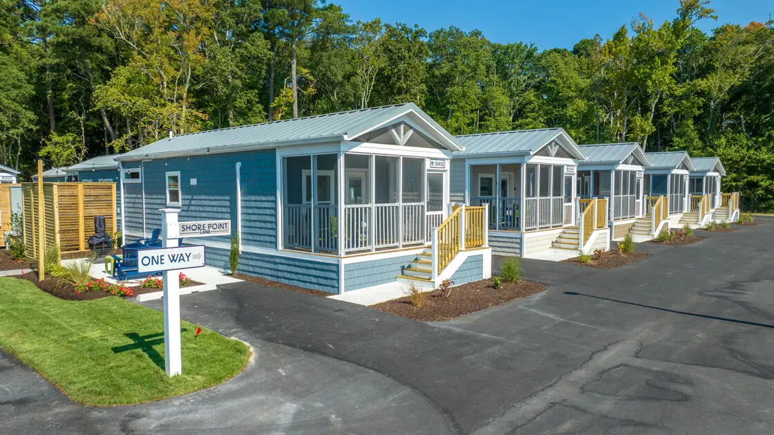 Row of blue cottages at Shore Point Cottages