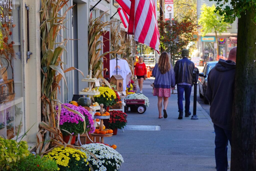 Downtown Warwick, NY sidewalk with fall flowers